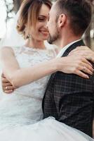 walk of the bride and groom through the autumn forest photo