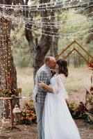 man and woman got engaged in autumn forest photo