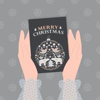 Merry Christmas greeting card in folk style in female hands. vector