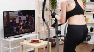 Young woman building her cardio in living room video