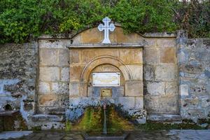 Drinking fountain at Bukovo monastery near Negotin in Eastern Serbia photo