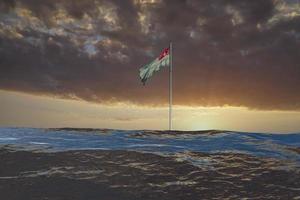 Seascape with the Abkhazian flag in the waves photo