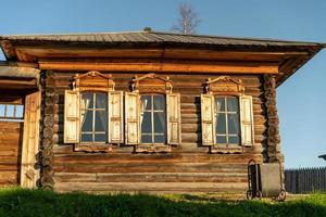 Facade of a wooden building with a window. photo