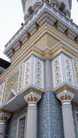 the mosque has a beautiful wall exterior. beautiful engraved wall texture of the mosque. the sacred building has a contemporary touch. photo