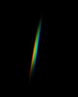 Rainbow light overlay on a black background photo