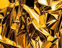 Crumpled gold abstract texture background photo