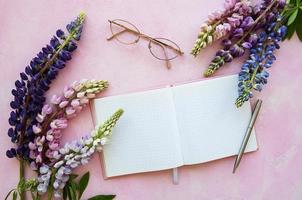 Mockup notebook with lupine flowers photo