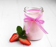 Jar with strawberry yogurt photo