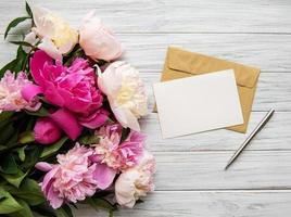 Envelope with pink peonies photo