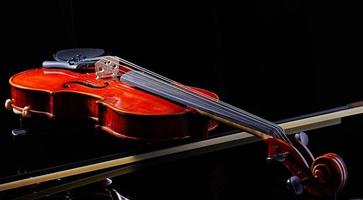 Violin on a black background, close-up. music concept. Details of the violin
