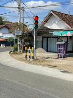 a traffic light in red. a traffic light is essential to manage traffic in the city. modern traffic lamp at the crossroad. photo