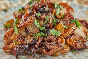 Jerusalem artichoke with shallots and herbs fried in pan photo