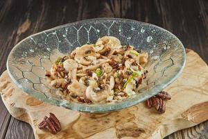 Salad with mushrooms, champignons and pecans. French gourmet cuisine photo