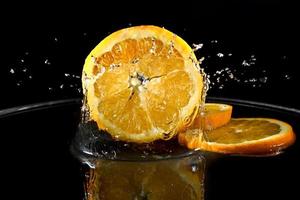 Citrus fruits in water photo