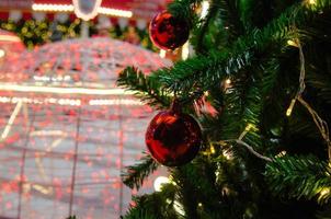 Christmas tree decorations with lights and red balls photo