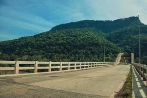 Tied-arch bridge Ernesto Dornelles made of concrete over the Antas River, amid wooded landscape near Bento Goncalves. A friendly country town in southern Brazil famous for its wine production. photo