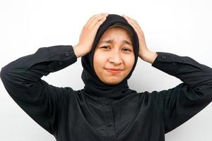 Closeup of beautiful young Muslim woman stressed, panicked, shocked, isolated photo