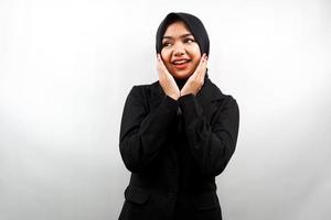 Beautiful young asian muslim business woman smiling confident, enthusiastic and cheerful with  hands V sign on chin isolated on white background photo