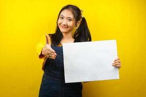 Pretty and cute young woman cheerful holding blank empty banner, placard, white board, blank sign board, white advertisement board, presenting something in copy space, promotion photo