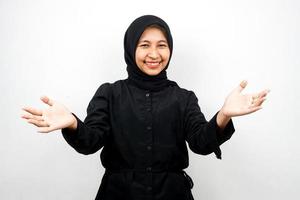 Beautiful young asian muslim woman smiling cheerfully, with open arms to camera, welcome sign hand, hand sign wanting to hug, isolated on white background photo