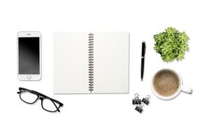 White office desk table with a lot of things on it. Top view photo