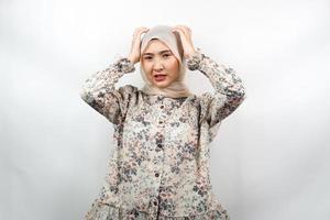 Beautiful young asian muslim woman stressed, shocked, dizzy, unhappy, many problems, want solution, with hands holding head isolated on white background