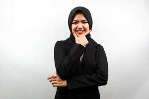Beautiful young asian muslim business woman smiling confident, enthusiastic and cheerful with hands V sign on chin isolated on white background photo