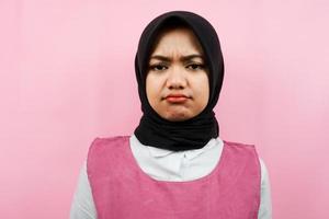 Closeup of beautiful young muslim woman pouting, sad, isolated photo