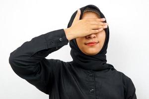 Closeup of beautiful young Muslim woman closing her eyes isolated photo