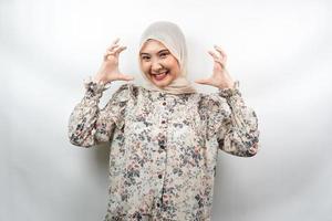 Beautiful young asian muslim woman shocked, dizzy, stressed, unhappy, many problems, want solution, with hands on head isolated on white background photo