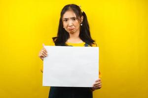 Pretty and cute young woman sad, hand holding blank empty banner, placard, white board, blank sign board, white advertisement board, presenting something in copy space, promotion photo