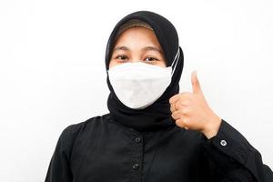 Closeup of beautiful young Muslim woman wearing white mask, ok sign hand, corona, covid-19, isolated photo