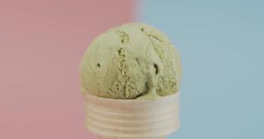 Green tea in waffle cone isolated on two tone background, Front view Food concept. video