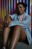 Smiling young african american woman looking at camera. photo