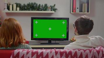 Couple Watching Green Screen TV on Couch in Living Room Together. video