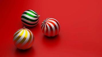 Representación 3d de 3 adornos de bolas para decorar navidad y año nuevo sobre fondo rojo foto