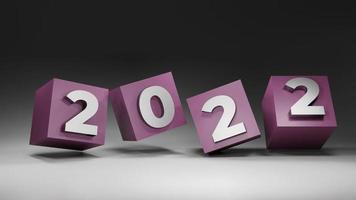 3d rendering new year 2022 on pink cube with grey background photo