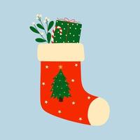 Calcetín navideño rojo con caja de regalo, rama de muérdago y bastón de caramelo. elemento de diseño de invierno de Navidad en estilo doodle. vector