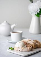 Apple strudel with ice cream and cinnamon. Baked cake and tea, delicious dessert photo