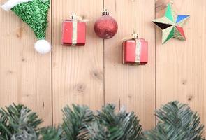 christmas background with decorations on wooden board photo