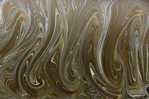 Fondo abstracto de textura de patrón de tinta de mármol. tono oro negro y blanco foto