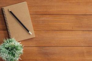 Minimal work space - Creative flat lay photo of workspace desk. Office desk wooden table background with open mock up notebooks and pens and plant. Top view with copy space, flat lay photography.