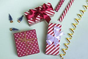 Christmas background. Beautiful gift boxes with decorations on a blue background. Close up, top view photo