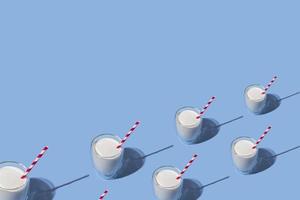 World Milk Day. Glass of milk with a red straw against a blue background. Seamless pattern. Sample. Package. photo