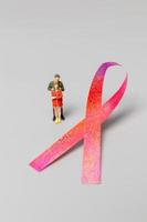 Couple standing in front a ribbons , World cancer day concept photo