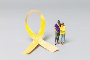 Couple standing in front a ribbons , World cancer day concept photo