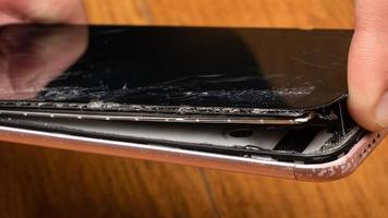 chip crack on the glass of the phone, broken touchscreen smartphone