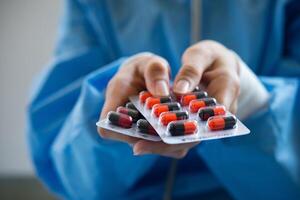 Woman pharmacist holding prescription medicine from doctor order photo