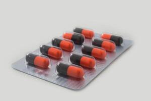 Panel of capsules medicine pills from doctor order photo