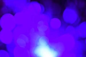 purple and blue neon light abstract Neon bright lens flare colored on black background.dark abstract futuristic background and Neon backgrounds photo